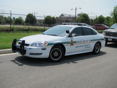 1991 Ford LTD Crown Victoria - white Orange County Florida Sheriff Chevrolet Impala unit 641 with a front push bumper.