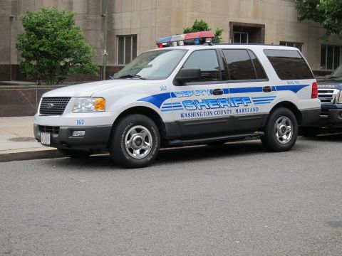 1991 Ford LTD Crown Victoria - white Ford Expedition marked Deputy Sheriff, Washington County Maryland, with blue stripes and roof lightbar.