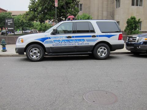 1991 Ford LTD Crown Victoria - Side view of a white Washington County Maryland Deputy Sheriff Ford Expedition parked along a curb.