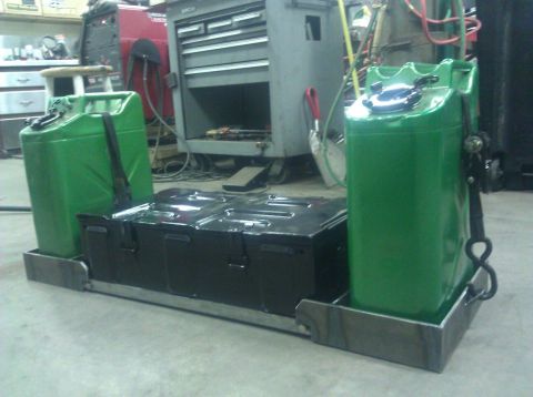 1979 Ford Bronco - Custom metal frame holding two Jerry cans and a storage box, likely for off-road or utility use.