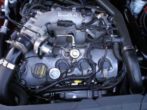 1997 Ford Taurus - Close-up view of a vehicle's engine bay, showing various components and wiring.
