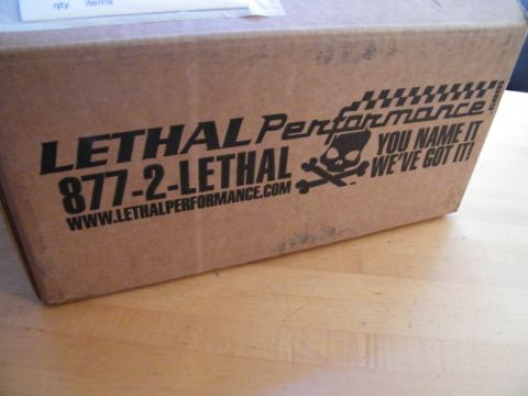 2004 Ford Crown Victoria - A box from Lethal Performance, a company specializing in automotive parts.