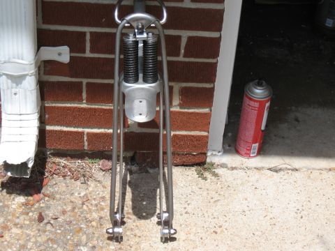 1994 Ford Bronco - Motorcycle front suspension fork assembly with dual springs and chrome legs.