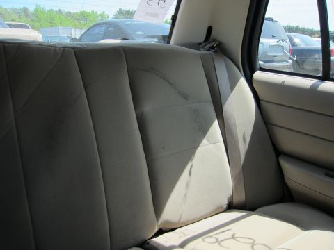 2001 Ford Crown Victoria - Rear interior of a 2001 Ford Crown Victoria, showing the seats and seatbelts.