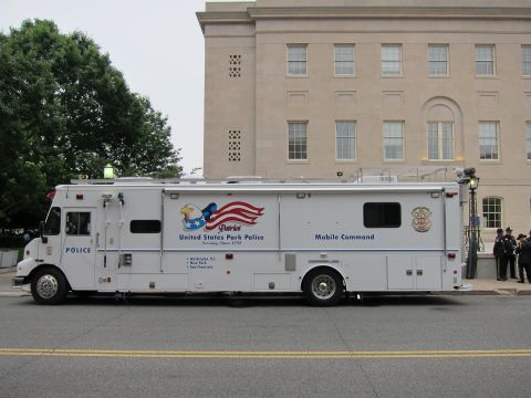 1991 Ford LTD Crown Victoria - white United States Park Police Mobile Command truck parked along a street, with uniformed personnel standing nearby.