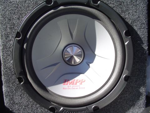 1999 Ford Taurus - Close-up of a Pioneer IMPP subwoofer, likely installed in a vehicle's trunk.