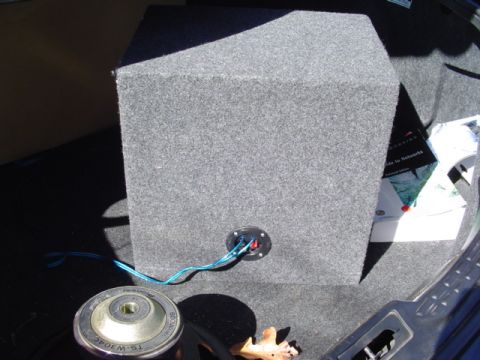 1999 Ford Taurus - A car subwoofer and speaker are placed in the trunk of a vehicle.