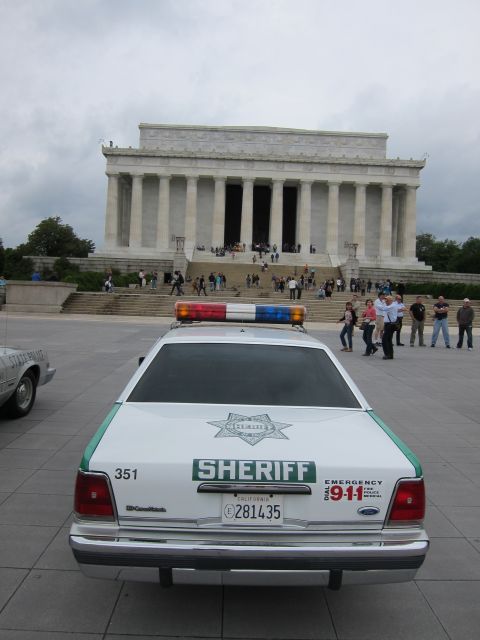 1991 Ford LTD Crown Victoria - green-and-white SHERIFF Ford Crown Victoria parked at the Lincoln Memorial as visitors gather on the steps.