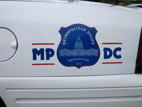 1991 Ford LTD Crown Victoria - Close-up of a Metropolitan Police Washington DC door decal showing a blue Capitol-dome shield and MPDC lettering.