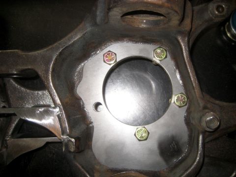 1996 Ford Bronco - Steering knuckle assembly with an aftermarket adapter plate installed.