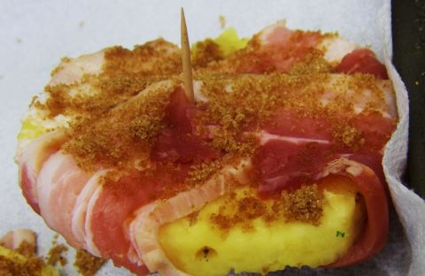 1989 Ford Bronco - A close-up of a food item prepared with bacon and brown sugar, secured by a toothpick.