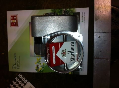 2010 Dodge Challenger - A throttle body is shown with a pack of Marlboro cigarettes placed inside its opening.