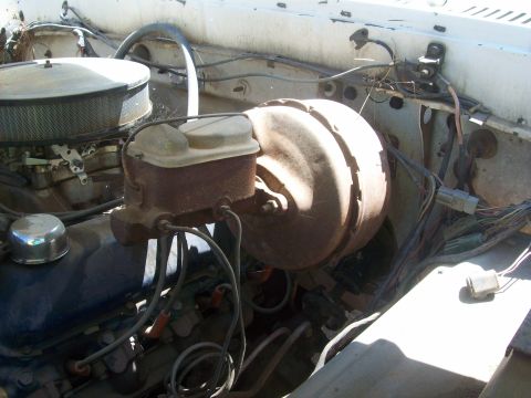 1965 Ford 427 - Close-up view of the engine bay, focusing on the brake system components and air intake.
