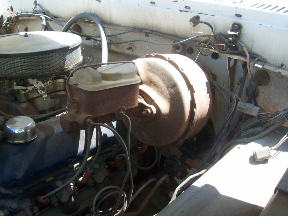 Engine bay showing brake booster, master cylinder, and air cleaner assembly