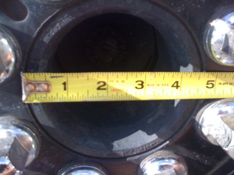 1997 Dodge 3500 - A measuring tape is placed over a vehicle's wheel hub, showing its diameter.