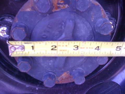1997 Dodge 3500 - Measuring tape across a vehicle's wheel hub.