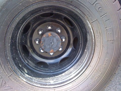 1997 Dodge 3500 - This is a close-up view of a truck's wheel hub, showing the lug nuts and the central cap.