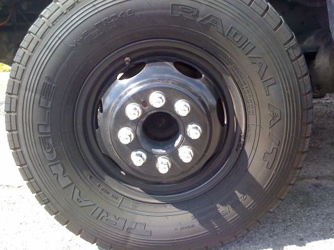 1997 Dodge 3500 - Close-up of a truck's wheel and tire, showing the lug nuts and tire tread details.