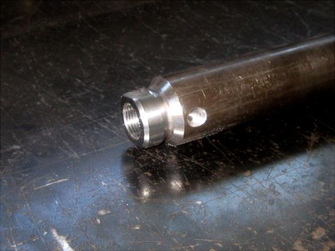 1996 Ford Bronco - Close-up of a metal rod with a threaded fitting and a small hole.