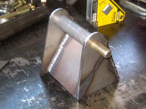 1996 Ford Bronco - Custom metal bracket with a bolt, likely for automotive repair or modification.
