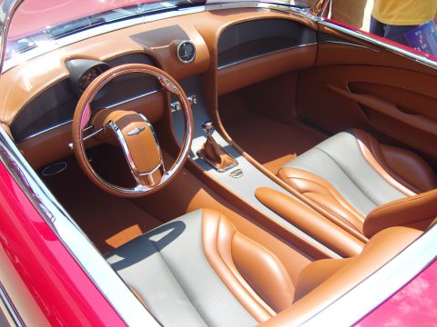 2007 Ford Mustang - The custom interior features tan leather seats and dashboard accents, complemented by chrome trim and a distinctive steering wheel.