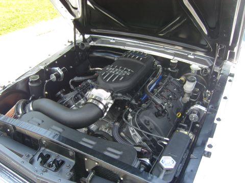 2007 Ford Mustang - The engine bay features a prominent black intake manifold clearly marked with 'BOSS 302'.