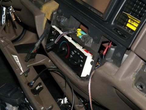 2003 Ford Crown Victoria - Open center console of a Crown Victoria showing HVAC unit and routed wiring