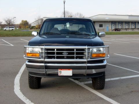 1995 Ford Bronco - Front view of a black Ford Bronco, likely from the early to mid-1990s, with a chrome grille guard.