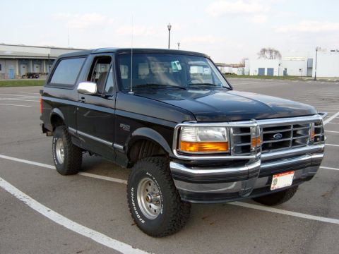 1995 Ford Bronco - Front 3/4 view of a black 1995 Ford Bronco parked in an outdoor lot.