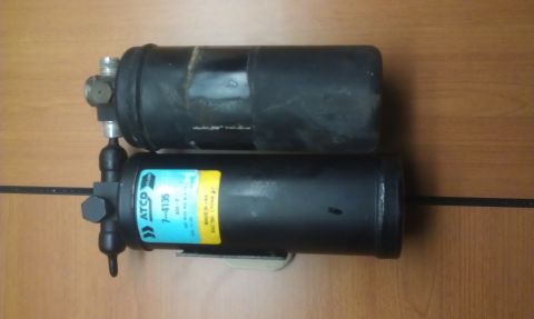 1991 Ford Festiva - Two automotive AC receiver-drier units are shown, one with a visible ATCO part number.