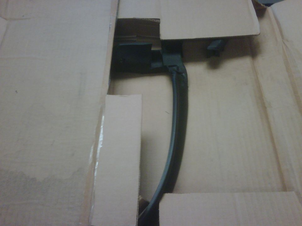 black car door handle inside cardboard box