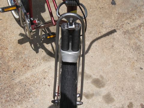 1994 Ford Bronco - A bicycle's front end is shown from a low angle, revealing its tire and suspension system.