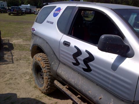 1999 Isuzu Vehicross - This silver SUV, marked with NASA and '33' decals, is seen in a 3/4 front view, appearing to be off-road.