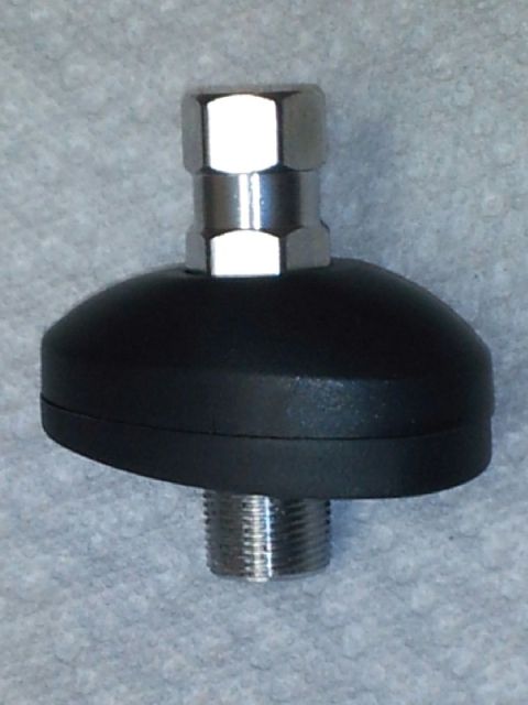 2011 Ford Ranger - Close-up of an antenna base with threaded mounting hardware.