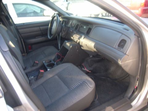 2005 Ford Crown Victoria - Interior view of a 2005 Ford Crown Victoria, likely a former police vehicle.