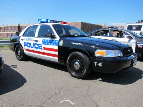 1991 Ford LTD Crown Victoria - black-and-white New Britain Police Traffic unit, a Ford Crown Victoria with American-flag side graphics, marked T-5.