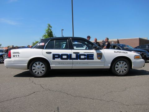 1991 Ford LTD Crown Victoria - white Meriden Police Supervisor Ford Crown Victoria with officers standing behind it in a parking lot.