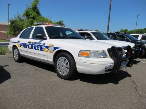1991 Ford LTD Crown Victoria - white State Capitol Police Ford Crown Victoria cruiser with brush guard, marked C-3, parked by other units.