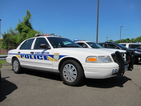 1991 Ford LTD Crown Victoria - white State Capitol Police Ford Crown Victoria cruiser marked C-3 with brush guard parked in a lined lot.