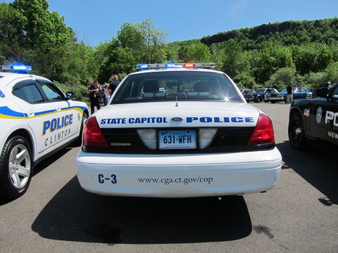 1991 Ford LTD Crown Victoria - rear of a white Ford Crown Victoria lettered STATE CAPITOL POLICE with Connecticut plate 631-WFH between other cruisers.