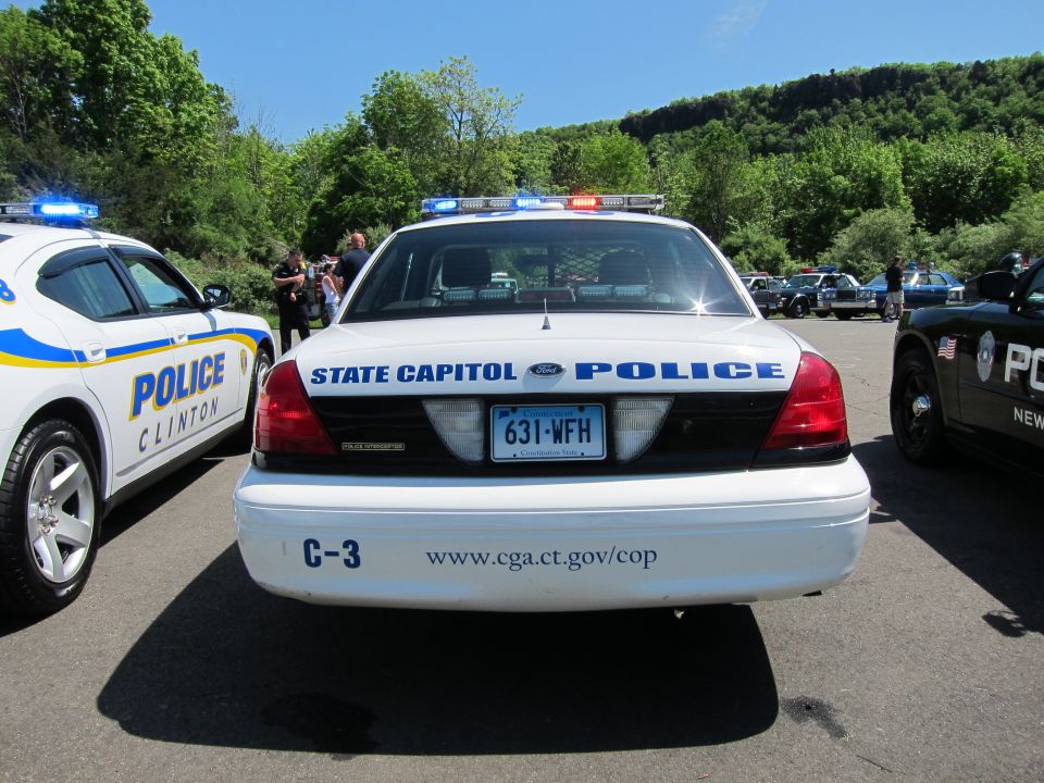 Rear of white Ford Crown Victoria marked STATE CAPITOL POLICE, plate 631-WFH