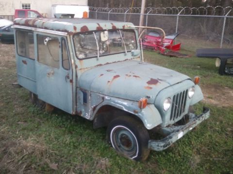 1978 Ford Bronco - This weathered panel van, likely a custom build or utility vehicle, shows significant signs of age and disuse.