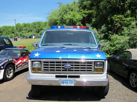 1991 Ford LTD Crown Victoria - Front view of a blue and white Ford van painted with white stars, a chrome grille and Connecticut plate 56-101.