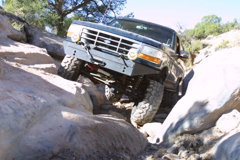 1994 Ford Bronco - This 1994 Ford Bronco is tackling a challenging off-road course with steep rock inclines.