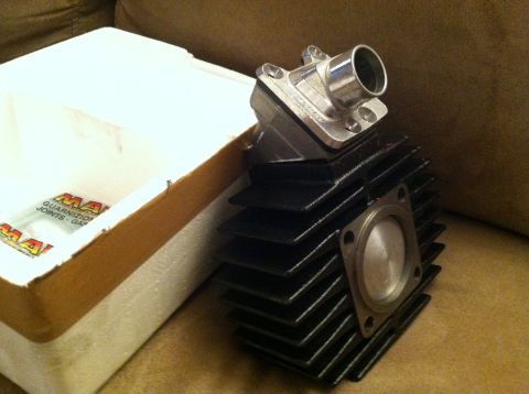 1981 Garelli Rally Sport - A Malossi branded motorcycle engine cylinder and intake manifold are shown next to their packaging.
