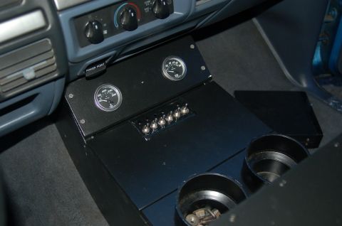 1992 Ford F-150 - The interior of a 1992 Ford F-150 features a custom console with auxiliary gauges and switches.