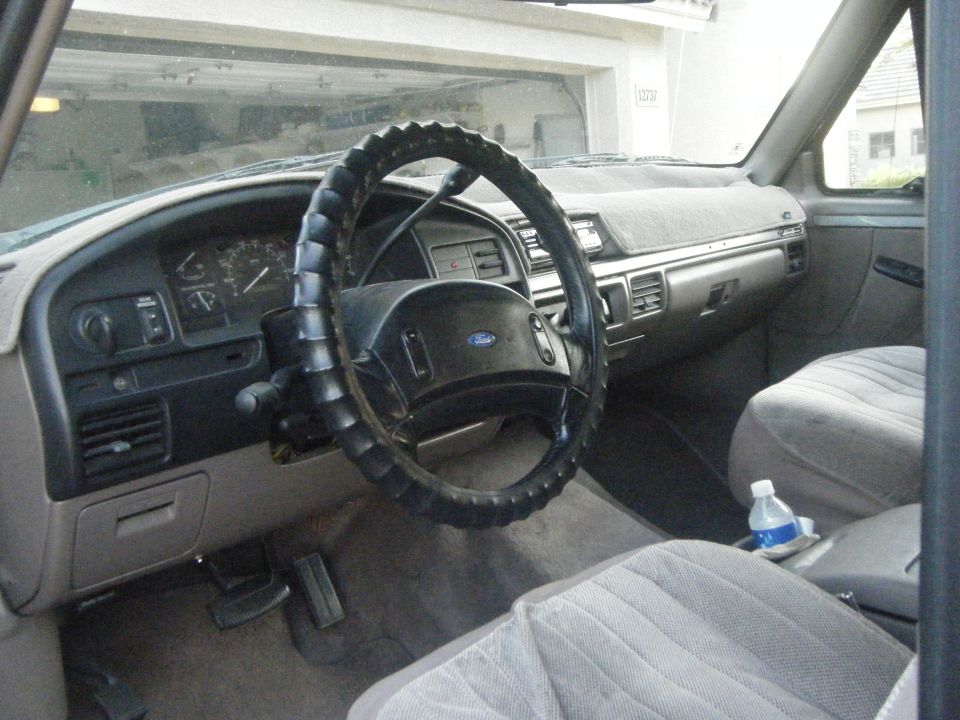 1993 Ford Bronco interior showing dashboard, steering wheel, and seats