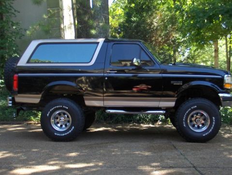 1993 Ford Bronco - This 1993 Ford Bronco features a two-tone black and tan paint scheme and a removable top.