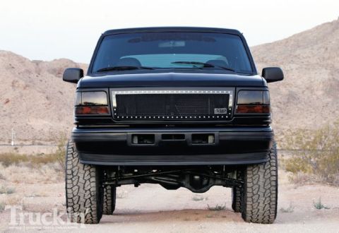 1993 Ford Bronco - Front view of a lifted 1993 Ford Bronco with a custom grille and LED accent lights.