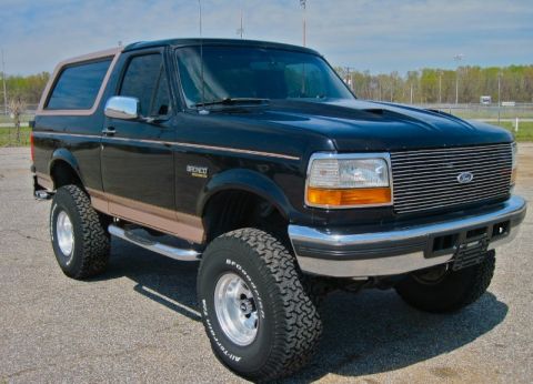 1993 Ford Bronco - This lifted 1993 Ford Bronco features a custom grille and two-tone paint.